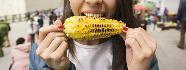 person eating corn on the cob